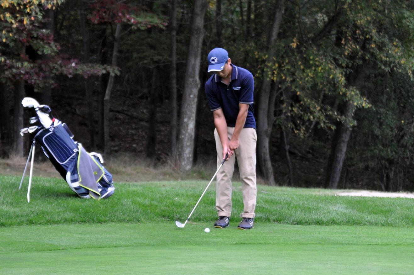 Photo (by Brent Baird): Penn State Altoona sophomore Pongthong Thongyai putts during Saturday's Penn State Altoona Invitational at Sinking Valley Country Club.