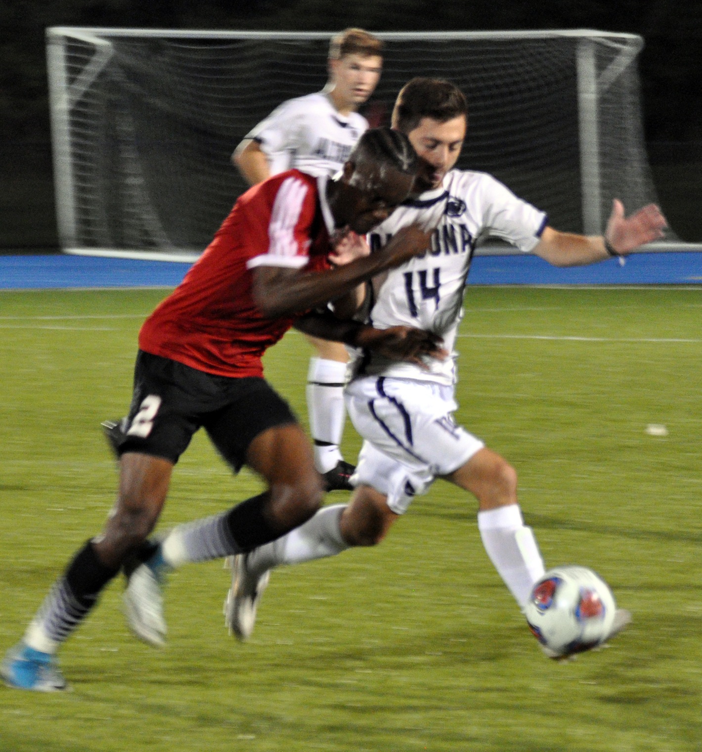 Photo (by Joel Nelson): Penn State Altoona senior midfielder Seth Murrelle battles for the ball with La Roche College's Dante Nicholas during the Lions' win at Spring Run Stadium on Tuesday evening.
