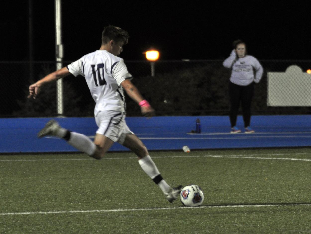 Photo (by Joel Nelson): Penn State Altoona sophomore Ben Jago winds up to take a shot during the Lions' loss to Mount Aloysius College on Wednesday night at Spring Run Stadium.