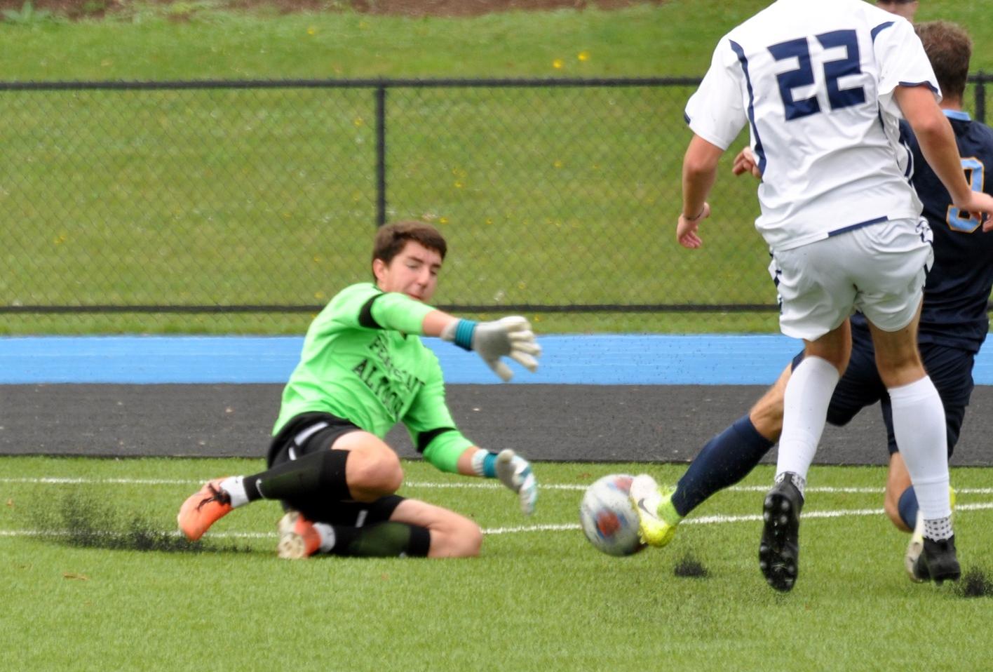 Photo (by Joel Nelson): Penn State Altoona sophomore goalkeeper Tanner Yaw slides to grab the ball during the Lions' loss to Medaille College on Saturday afternoon at Spring Run Stadium.