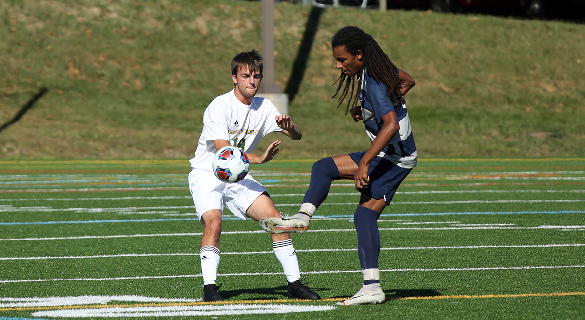 Photo (courtesy of SVC Sports Info): Freshman Jordan Francis kicks the ball past a St. Vincent College defender on Wednesday afternoon at UPMC Field.
