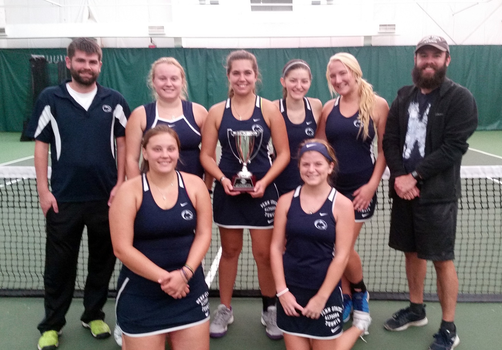 Photo: Penn State Altoona women's tennis coaches and players pose with the AMCC Runner-Up trophy after Sunday's conference championship match at Westwood Racquet Club.