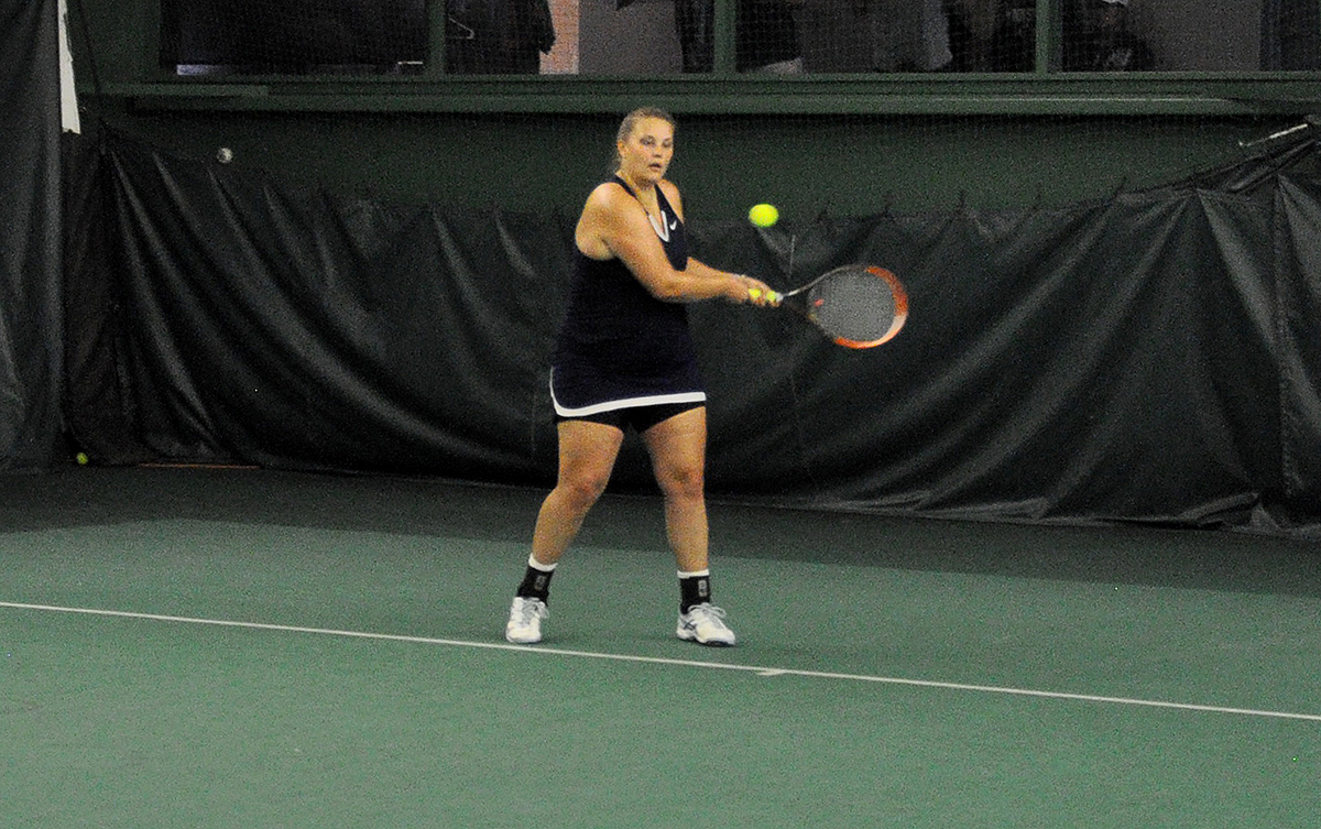 Photo: Junior Brayley Lewis hits a backhander during her singles match on Saturday against Pitt-Bradford at Gorilla House Gym.