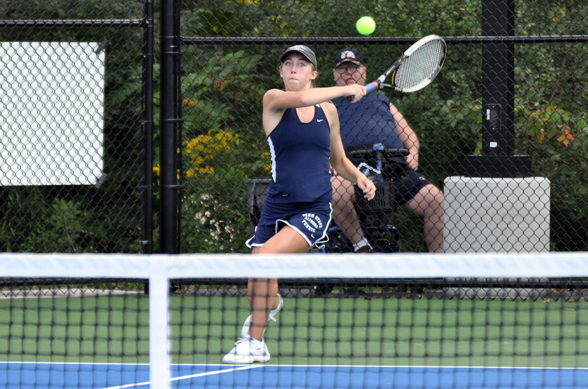 Photo: Freshman Jessica Stevens hits a forehand shot during Friday afternoon's match against Franciscan at the Adler Tennis Courts.