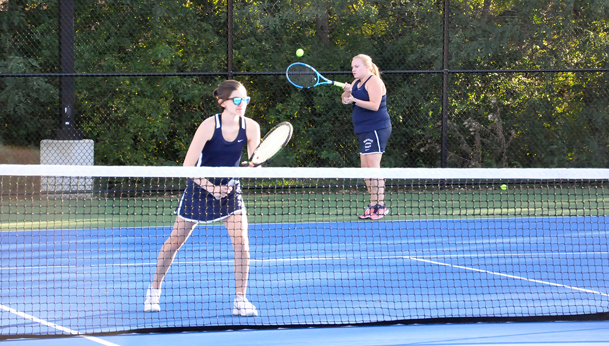 Photo: Sophia Girol (left) and Victoria Acker (right) compete in their No. 2 doubles match on Tuesday against Juniata.