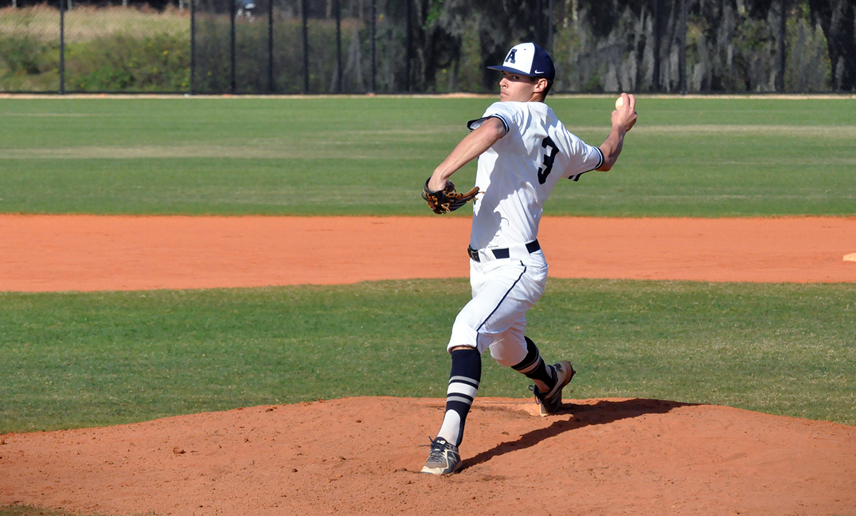 Photo (by Oliver Dailey): Sophomore Clayton Hain pitches during game two of Saturday's doubleheader against Aurora.