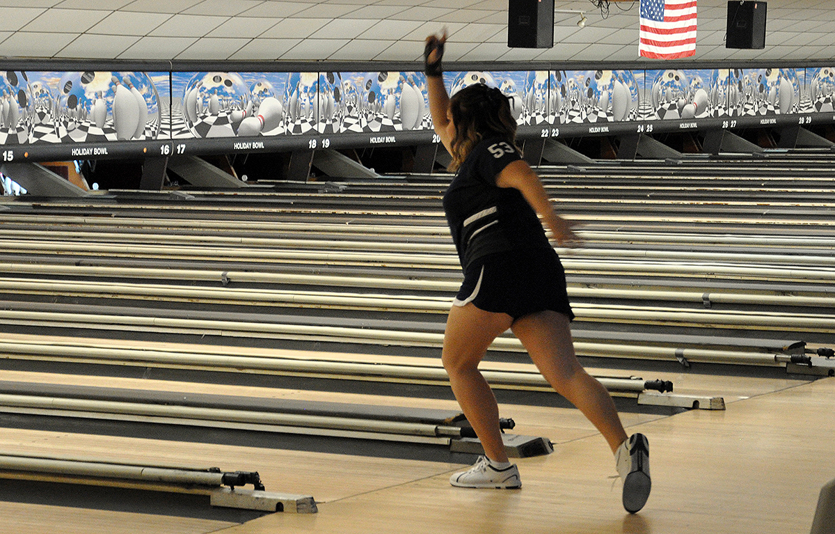 Photo: Freshman Ally Givler bowls against Mount St. Mary's University during the first day of the SFU Invitational on Friday at Holiday Bowl.