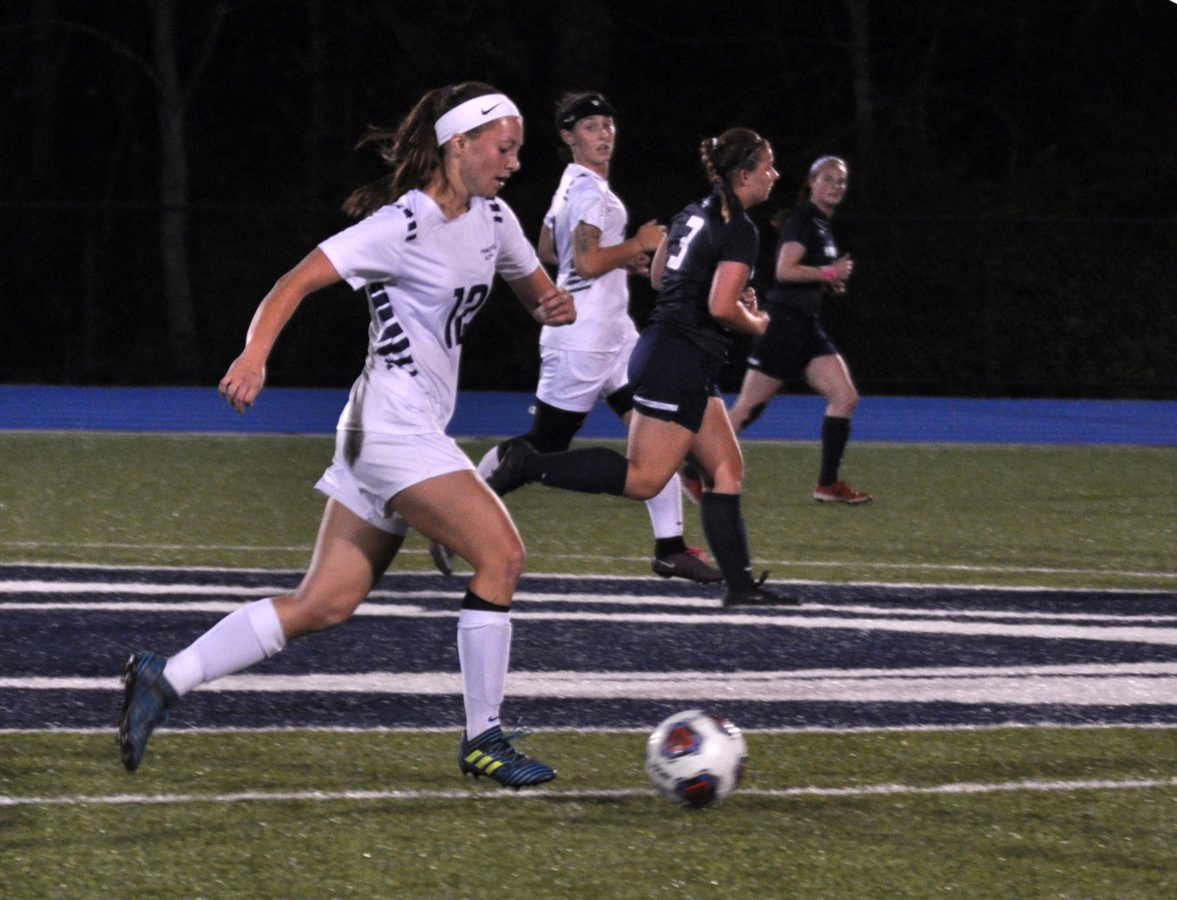 Photo (by Joel Nelson): Penn State Altoona freshman Haley Giedroc brings the ball across midfield during her team's game against Mount Aloysius College on Wednesday night at Spring Run Stadium.
