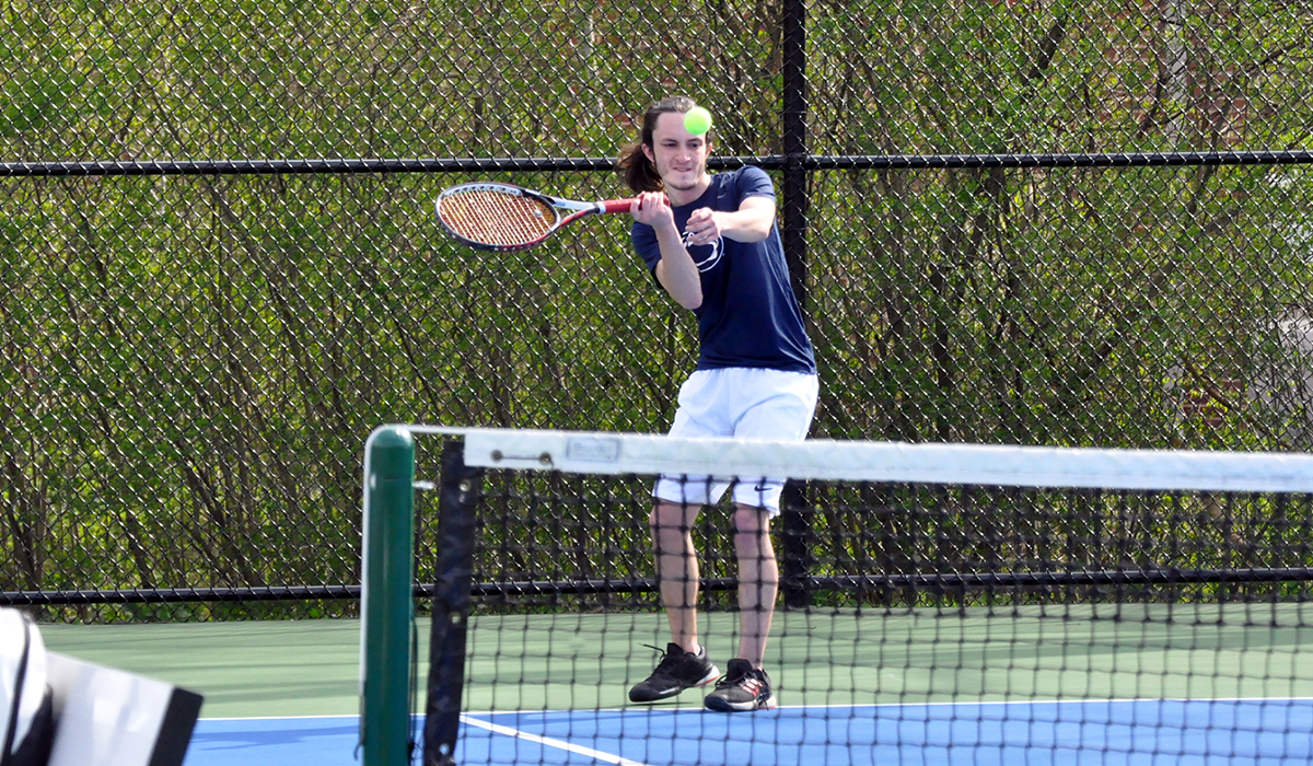 Photo: Freshman Jake Irwin hits a shot during Wednesday's match against Lancaster Bible at the Adler Tennis Courts.