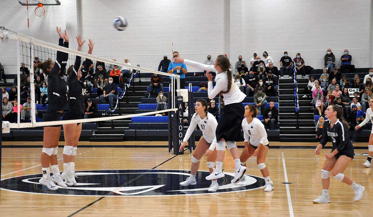 Photo: Junior Lydia Mock hits past a Mount Aloysius block during Tuesday night's win in the Adler Arena.